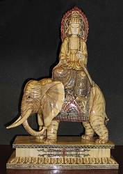 Carved and scrimshaw engraved elephant bone Kwanyin riding on Elephant with ivory detail (24 in. tall)- early 20th century