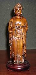 Standing chinese vintage carved Huangyang wood Buddha (10 in. tall)
