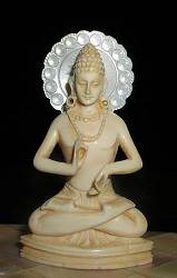 Small exquisite vintage Indian ivory Buddha seated in 'teaching posture' or dharmacakrapravartana mudra (2.4 in. tall)