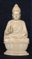 Extraordinary lifelike vintage Indian ivory Buddha - an unusual rendering of Ghanadaran style Shakyamuni Buddha seated in 'Gesture of Fearlessness' or 'blessing'  or abhaya mudra (7 in. tall) - early 20th C