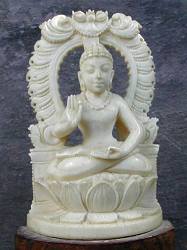 vintage Indian ivory Buddha seated in 'Gesture of Fearlessness' or 'blessing'  or abhaya mudra (5 in. tall) within an ornate aureole - early 20th C