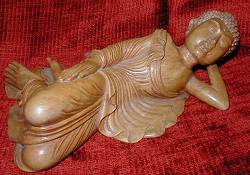 Reclining Buddha - masterfully carved of hardwood (10 in. long)