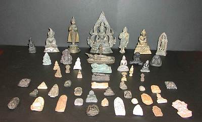 collection of small buddhas, buddha amulets and the like